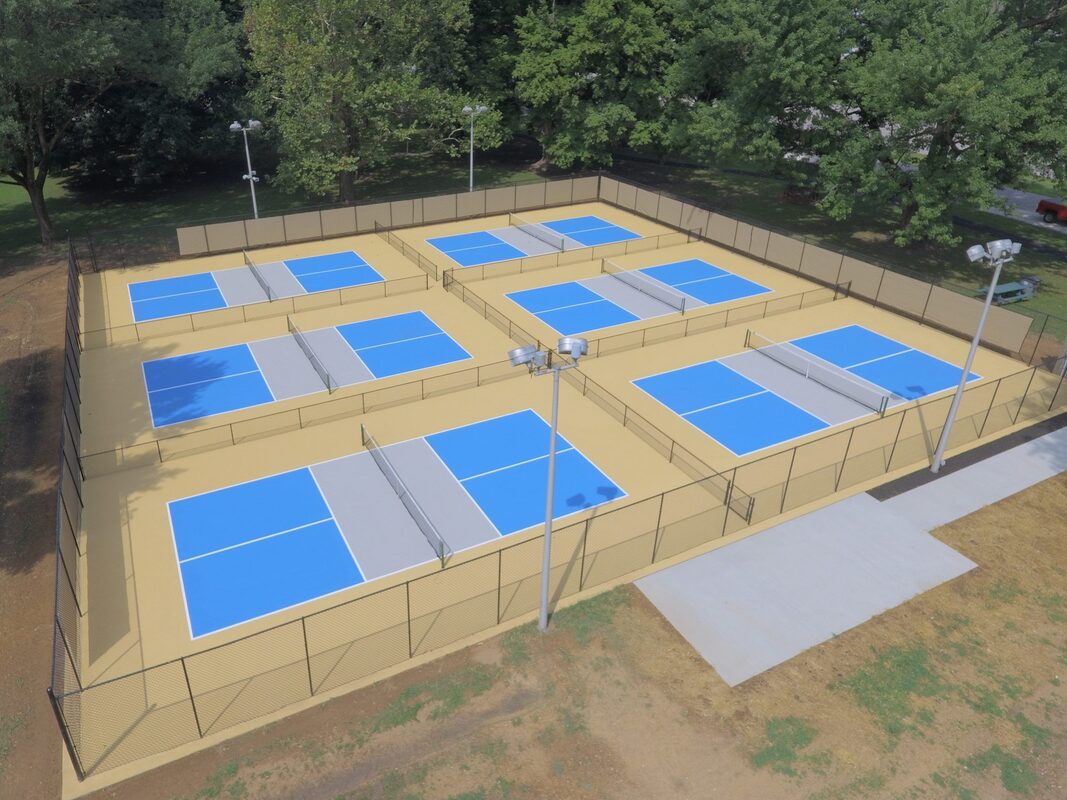Completed pickleball court complex with blue and green SportMaster acrylic coating