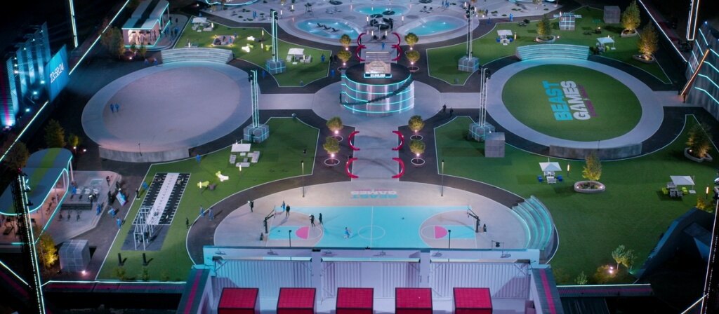Aerial night view of the Beast Games set with the basketball court in the foreground